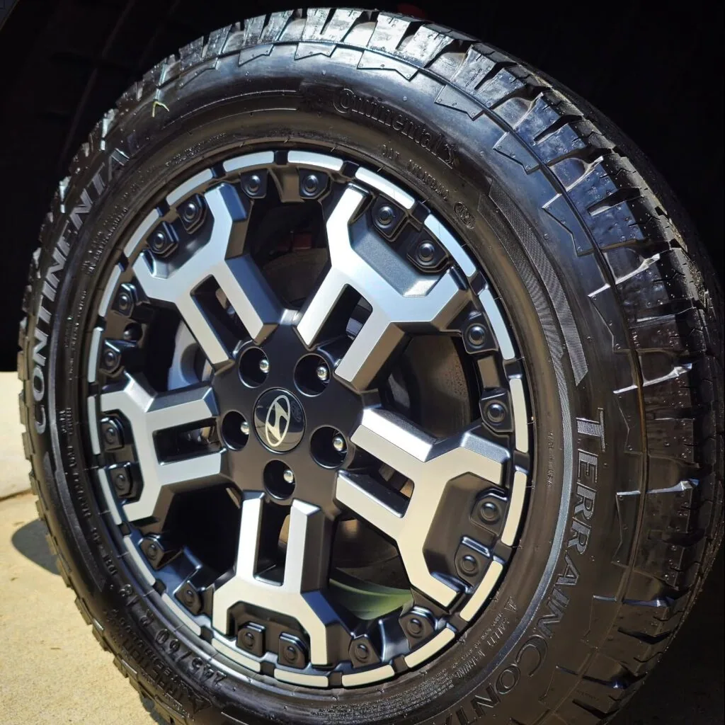 Close-up of a clean Hyundai alloy wheel with a Continental TerrainContact all-terrain tire after detailing