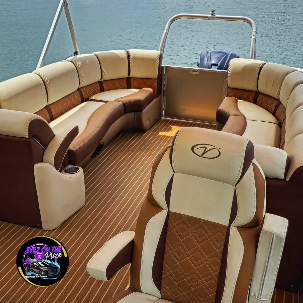 Cleaned tan and cream upholstery on a Veranda pontoon boat, showing the captain's chair, wraparound seating, and teak-style